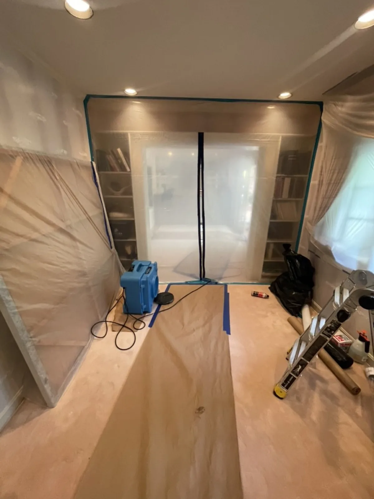 Water damage mitigation and structural drying equipment on an active job site